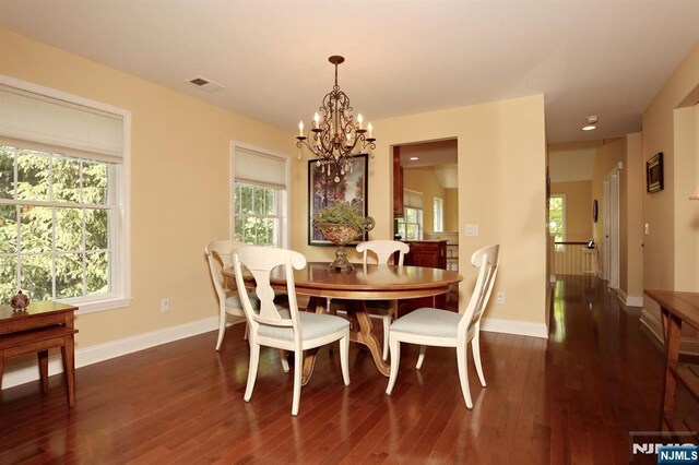 53 Pine Lake Ter Unit T053, River Vale, NJ 07675 - dining area featuring a chandelier and dark wood-style flooring