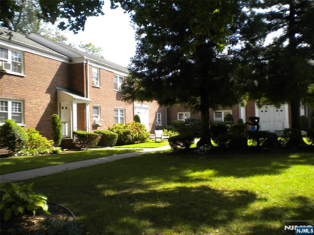 100 Huguenot Ave Unit 1B, Englewood, NJ 07631 - view of front of property featuring a front yard and brick siding
