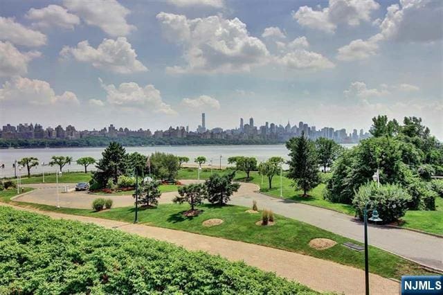 330 The Promenade, Edgewater, NJ 07020 - view of home's community featuring a water view, a view of skyline, and a lawn