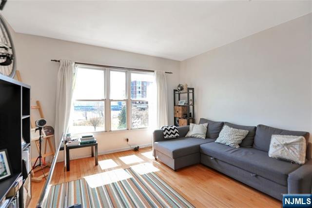330 The Promenade, Edgewater, NJ 07020 - living area featuring light wood-style floors
