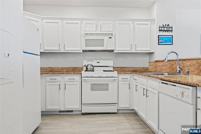 330 The Promenade, Edgewater, NJ 07020 - kitchen with white appliances, white cabinetry, and dark stone counters