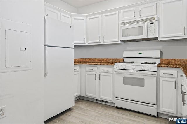 330 The Promenade, Edgewater, NJ 07020 - kitchen featuring white appliances, white cabinets, dark stone counters, and light wood finished floors
