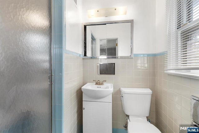 243 Lafayette Ave, Passaic, NJ 07055 - full bath featuring vanity, tile walls, and a shower stall