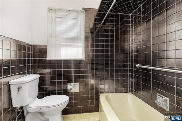 243 Lafayette Ave, Passaic, NJ 07055 - full bathroom with tile walls, a bath, and tile patterned flooring