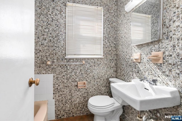 243 Lafayette Ave, Passaic, NJ 07055 - bathroom featuring a bathtub and tile walls