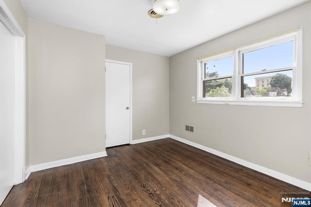 243 Lafayette Ave, Passaic, NJ 07055 - spare room with wood finished floors and baseboards