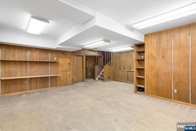 243 Lafayette Ave, Passaic, NJ 07055 - finished basement featuring stairs, wooden walls, and light colored carpet
