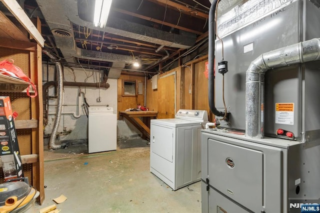 243 Lafayette Ave, Passaic, NJ 07055 - unfinished below grade area featuring separate washer and dryer and heating unit