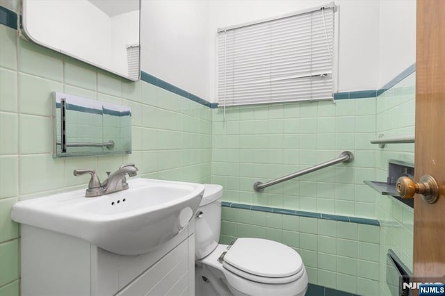 243 Lafayette Ave, Passaic, NJ 07055 - half bath featuring tile walls and vanity