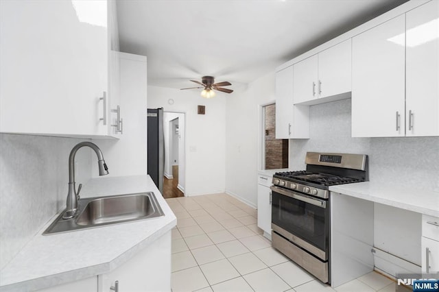 243 Lafayette Ave, Passaic, NJ 07055 - kitchen with stainless steel gas range, light countertops, decorative backsplash, and a ceiling fan