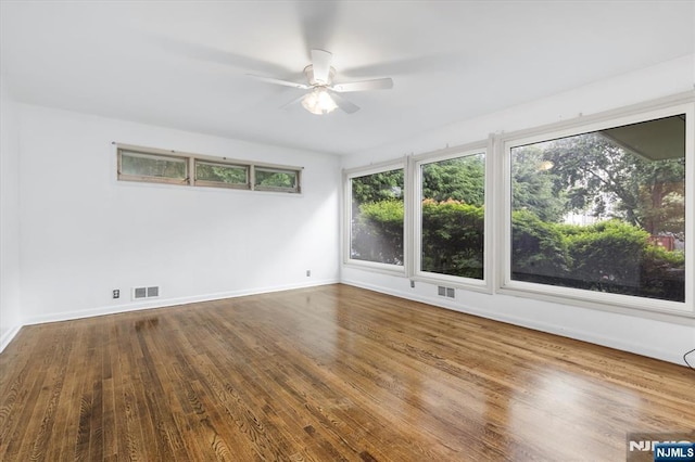 243 Lafayette Ave, Passaic, NJ 07055 - spare room with a ceiling fan, plenty of natural light, and wood finished floors