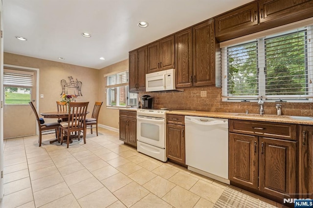30 Sinclair Dr, Wayne, NJ 07470 - kitchen featuring white appliances, recessed lighting, light tile patterned flooring, tasteful backsplash, and light countertops