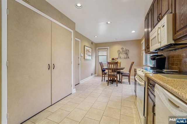 30 Sinclair Dr, Wayne, NJ 07470 - kitchen featuring white appliances, recessed lighting, light tile patterned floors, tasteful backsplash, and light stone counters