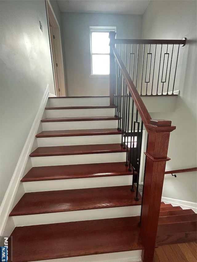 61 Grove, East Orange, NJ 07017 - staircase with wood finished floors and baseboards