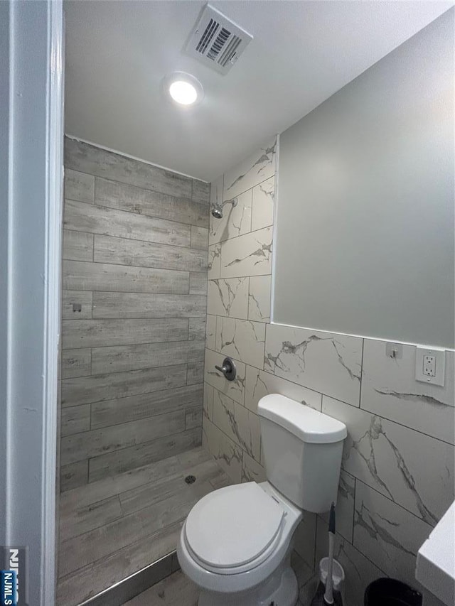 61 Grove, East Orange, NJ 07017 - full bath featuring a shower stall and tile walls