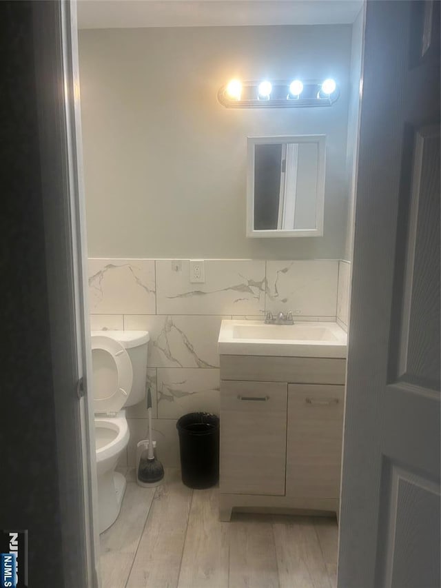 61 Grove, East Orange, NJ 07017 - bathroom featuring vanity and wood finished floors