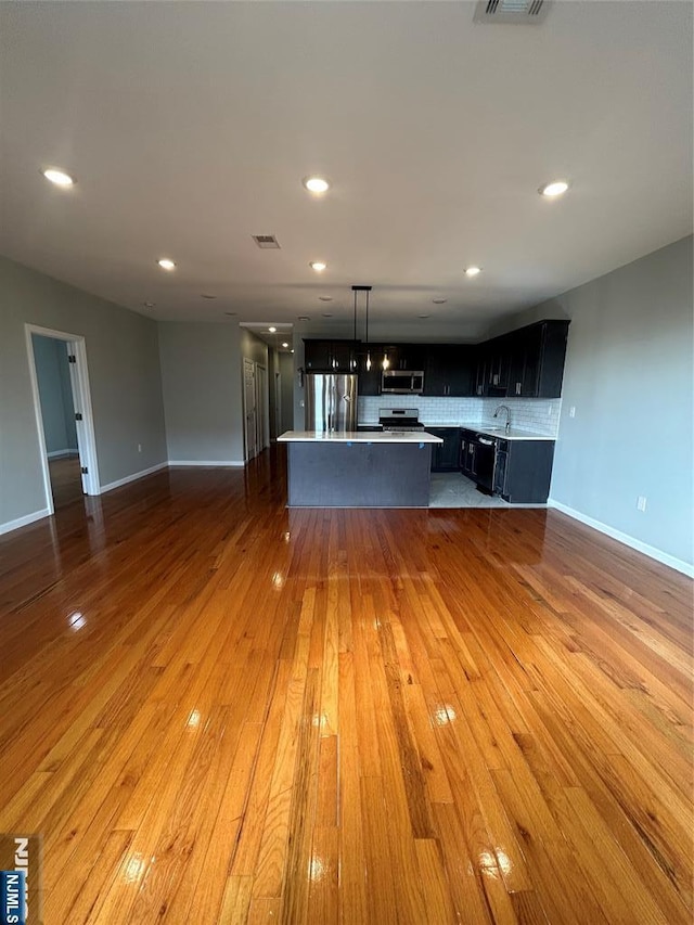 61 Grove, East Orange, NJ 07017 - unfurnished living room featuring light wood finished floors and recessed lighting