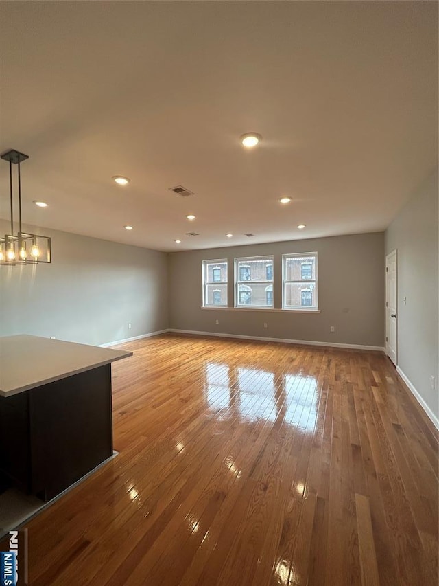 61 Grove, East Orange, NJ 07017 - unfurnished living room featuring hardwood / wood-style flooring and recessed lighting