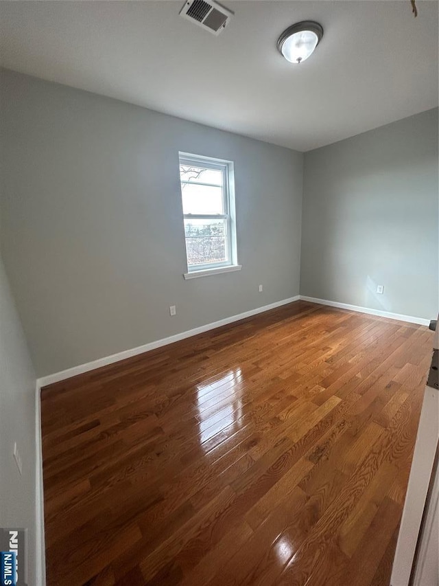 61 Grove, East Orange, NJ 07017 - unfurnished room featuring wood finished floors and baseboards