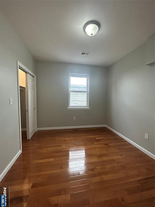 61 Grove, East Orange, NJ 07017 - unfurnished room with wood finished floors and baseboards