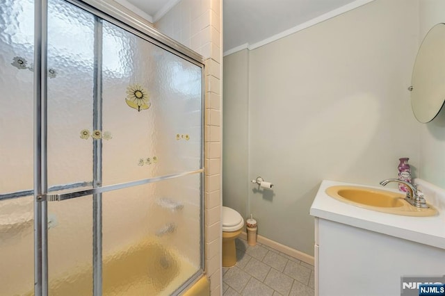 407 Elm St, Kearny, NJ 07032 - bathroom featuring vanity, tile patterned flooring, crown molding, and bath / shower combo with glass door