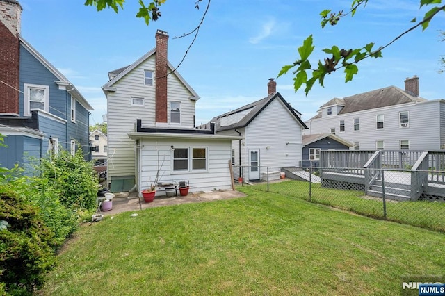 407 Elm St, Kearny, NJ 07032 - back of house with a fenced backyard and a deck
