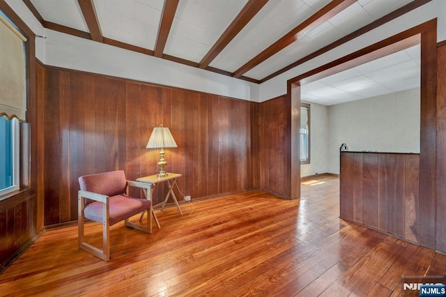407 Elm St, Kearny, NJ 07032 - sitting room with wood-type flooring, wooden walls, and beamed ceiling
