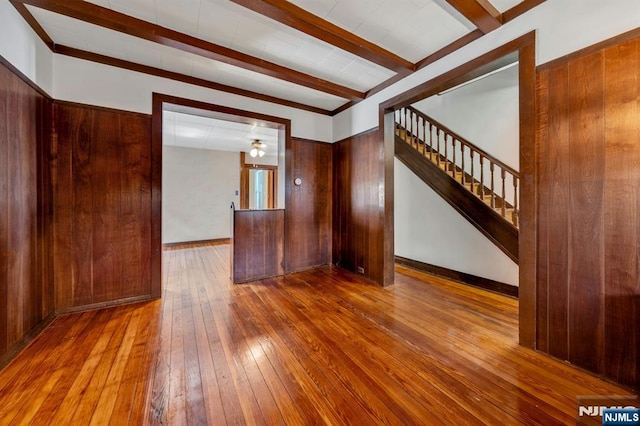 407 Elm St, Kearny, NJ 07032 - empty room featuring beamed ceiling, hardwood / wood-style flooring, and stairway