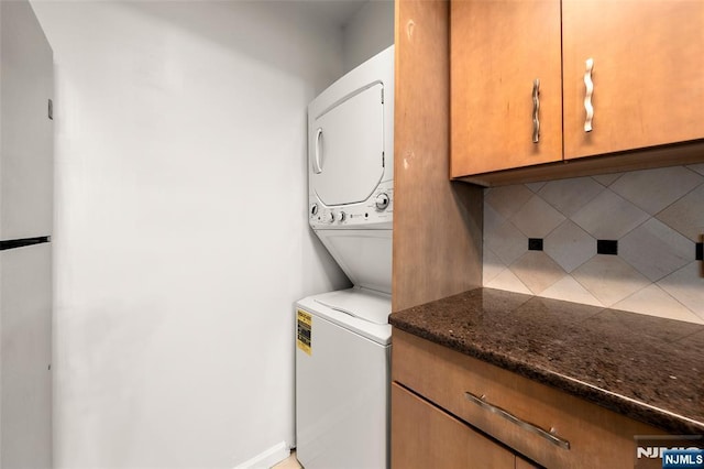 9019 Wall St Unit 6B, North Bergen, NJ 07047 - laundry area with estacked washer and dryer