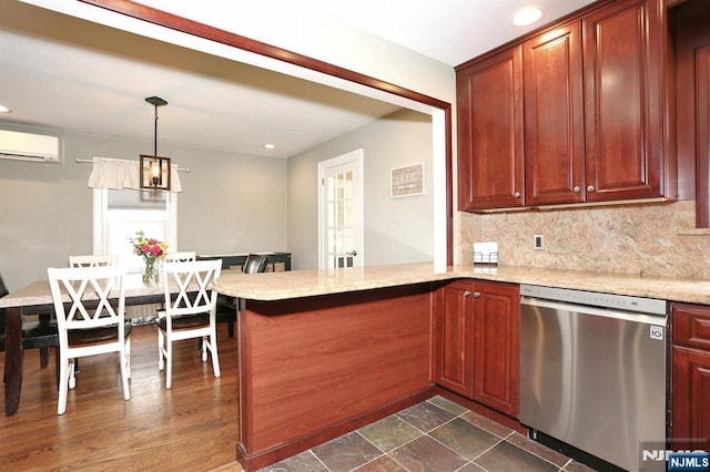 393 High St, Nutley, NJ 07110 - kitchen with stainless steel dishwasher, a wall unit AC, tasteful backsplash, a peninsula, and recessed lighting