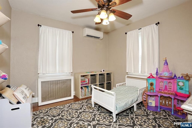 393 High St, Nutley, NJ 07110 - bedroom featuring a wall mounted AC, wood finished floors, and a ceiling fan
