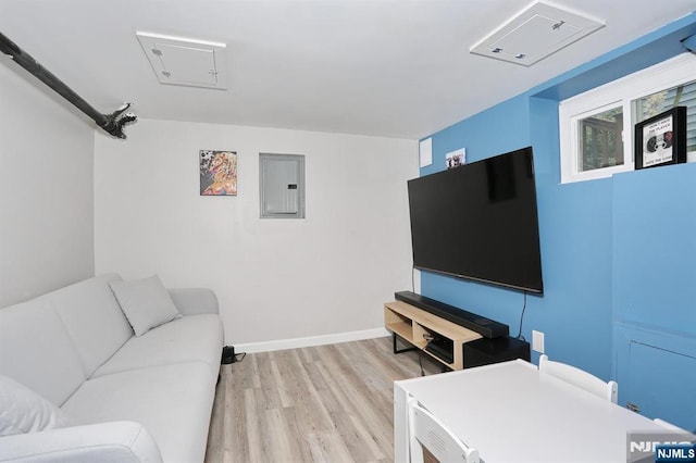 393 High St, Nutley, NJ 07110 - living room featuring electric panel, light wood-style flooring, and attic access