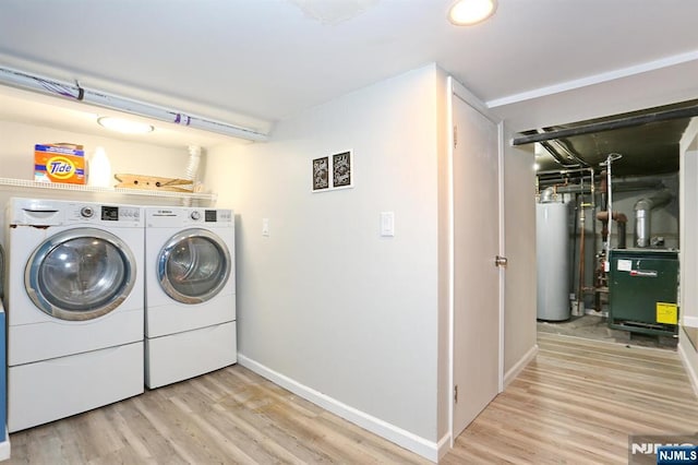 393 High St, Nutley, NJ 07110 - laundry room featuring gas water heater, washer and clothes dryer, light wood-style flooring, and a heating unit