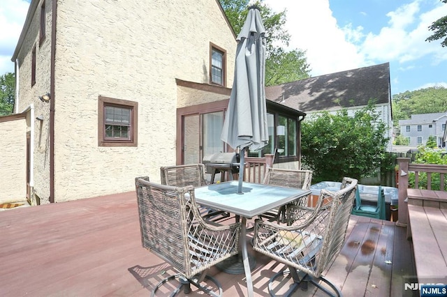 393 High St, Nutley, NJ 07110 - deck featuring outdoor dining area, a sunroom, and area for grilling