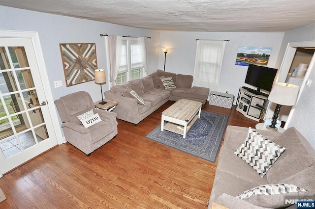 393 High St, Nutley, NJ 07110 - living room featuring wood finished floors and a textured ceiling