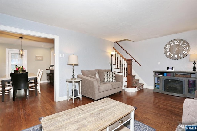 393 High St, Nutley, NJ 07110 - living area featuring wood finished floors, stairs, and a fireplace
