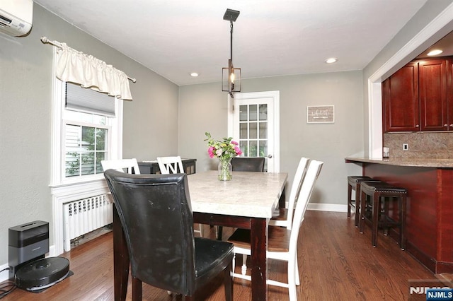 393 High St, Nutley, NJ 07110 - dining room featuring radiator, an AC wall unit, dark wood-style floors, and recessed lighting