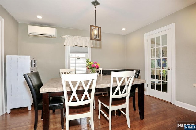 393 High St, Nutley, NJ 07110 - dining space featuring an AC wall unit, wood finished floors, and recessed lighting