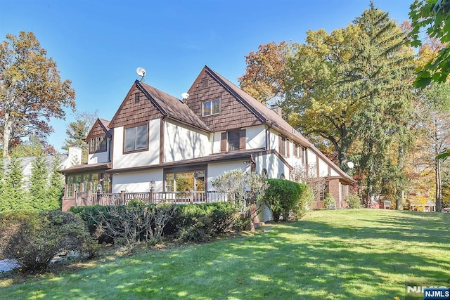 152 Highwood Ave, Tenafly, NJ 07670 - view of home's exterior with a lawn and stucco siding