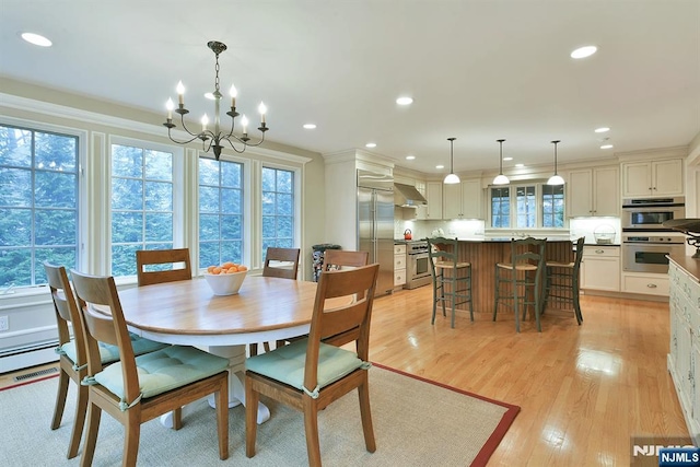 152 Highwood Ave, Tenafly, NJ 07670 - dining room with plenty of natural light, a chandelier, light wood-type flooring, recessed lighting, and ornamental molding