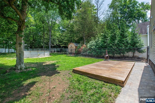 51 Lake Trl, Wayne, NJ 07470 - fenced backyard with a wooden deck and a storage shed