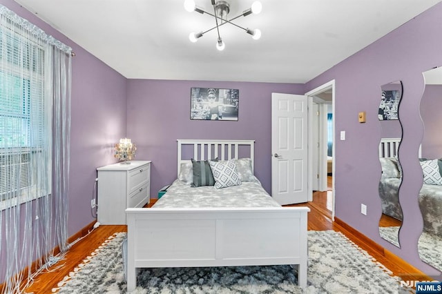 159 Oak Ridge Rd, West Milford, NJ 07438 - bedroom with wood finished floors and a chandelier