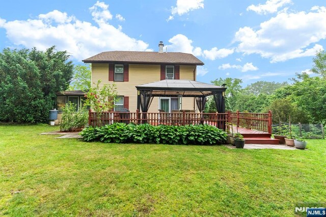 159 Oak Ridge Rd, West Milford, NJ 07438 - rear view of house with a gazebo, a chimney, a lawn, and a deck
