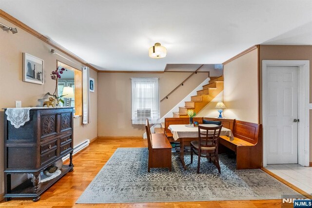 159 Oak Ridge Rd, West Milford, NJ 07438 - office area featuring wood finished floors, ornamental molding, and a baseboard heating unit