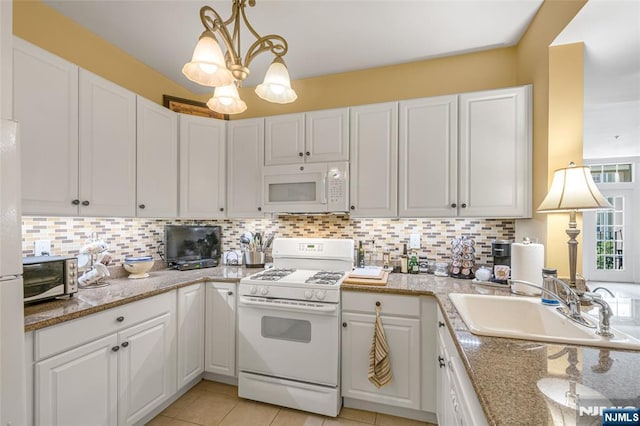 7108 Ravenscroft Rd Unit 555, Clifton, NJ 07013 - kitchen featuring white appliances, white cabinetry, and backsplash