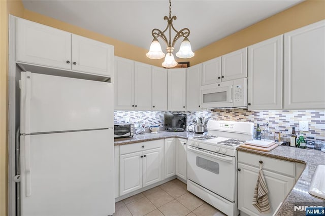 7108 Ravenscroft Rd Unit 555, Clifton, NJ 07013 - kitchen with white appliances, white cabinetry, a chandelier, and backsplash