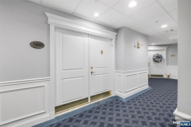 7108 Ravenscroft Rd Unit 555, Clifton, NJ 07013 - mudroom with dark carpet, a decorative wall, a paneled ceiling, a wainscoted wall, and recessed lighting
