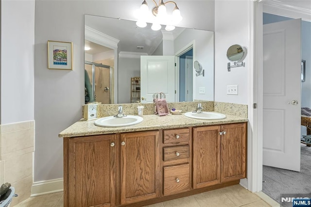 7108 Ravenscroft Rd Unit 555, Clifton, NJ 07013 - bathroom featuring crown molding, double vanity, a stall shower, and tile patterned floors