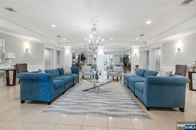 7108 Ravenscroft Rd Unit 555, Clifton, NJ 07013 - living room with a decorative wall, crown molding, light tile patterned flooring, a chandelier, and a wainscoted wall
