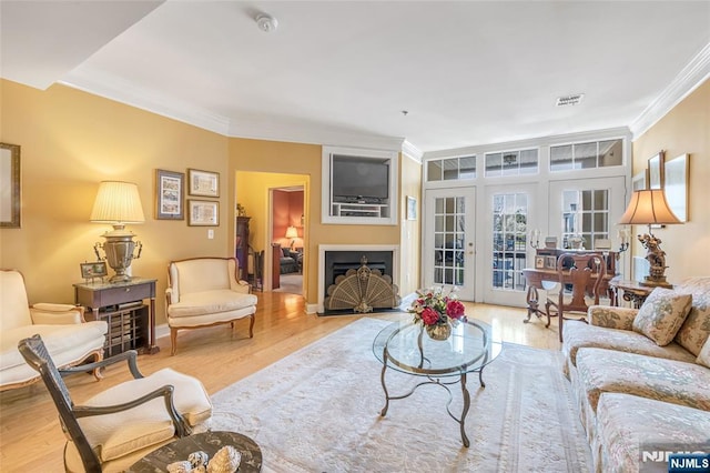 7108 Ravenscroft Rd Unit 555, Clifton, NJ 07013 - living room featuring ornamental molding, wood finished floors, a fireplace, and french doors